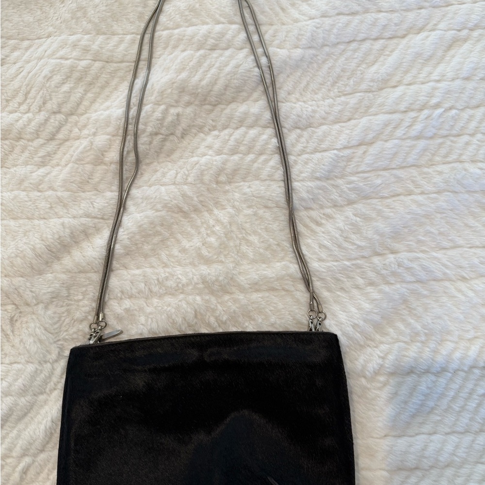 DKNY pony Hair Black Shoulder Bag/clutch. Metal strap is detachable.